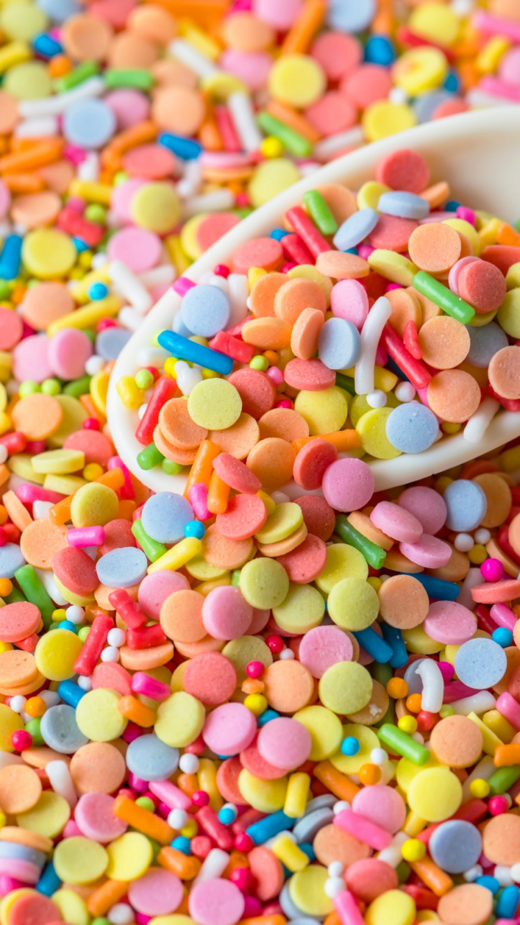 White Ceramic Bowl With Multi Colored Candies. Wallpaper in 750x1334 Resolution