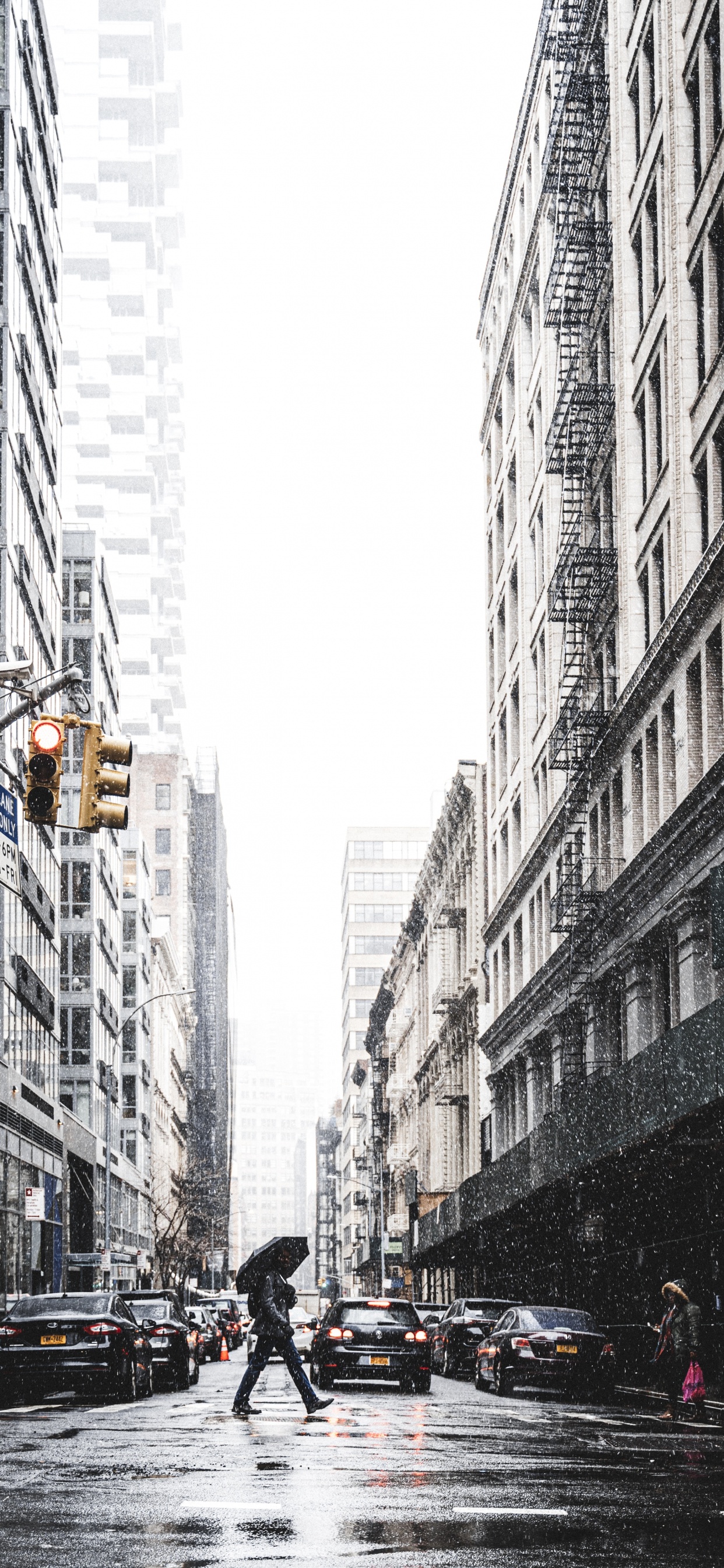 People Walking on Street Between High Rise Buildings During Daytime. Wallpaper in 1242x2688 Resolution