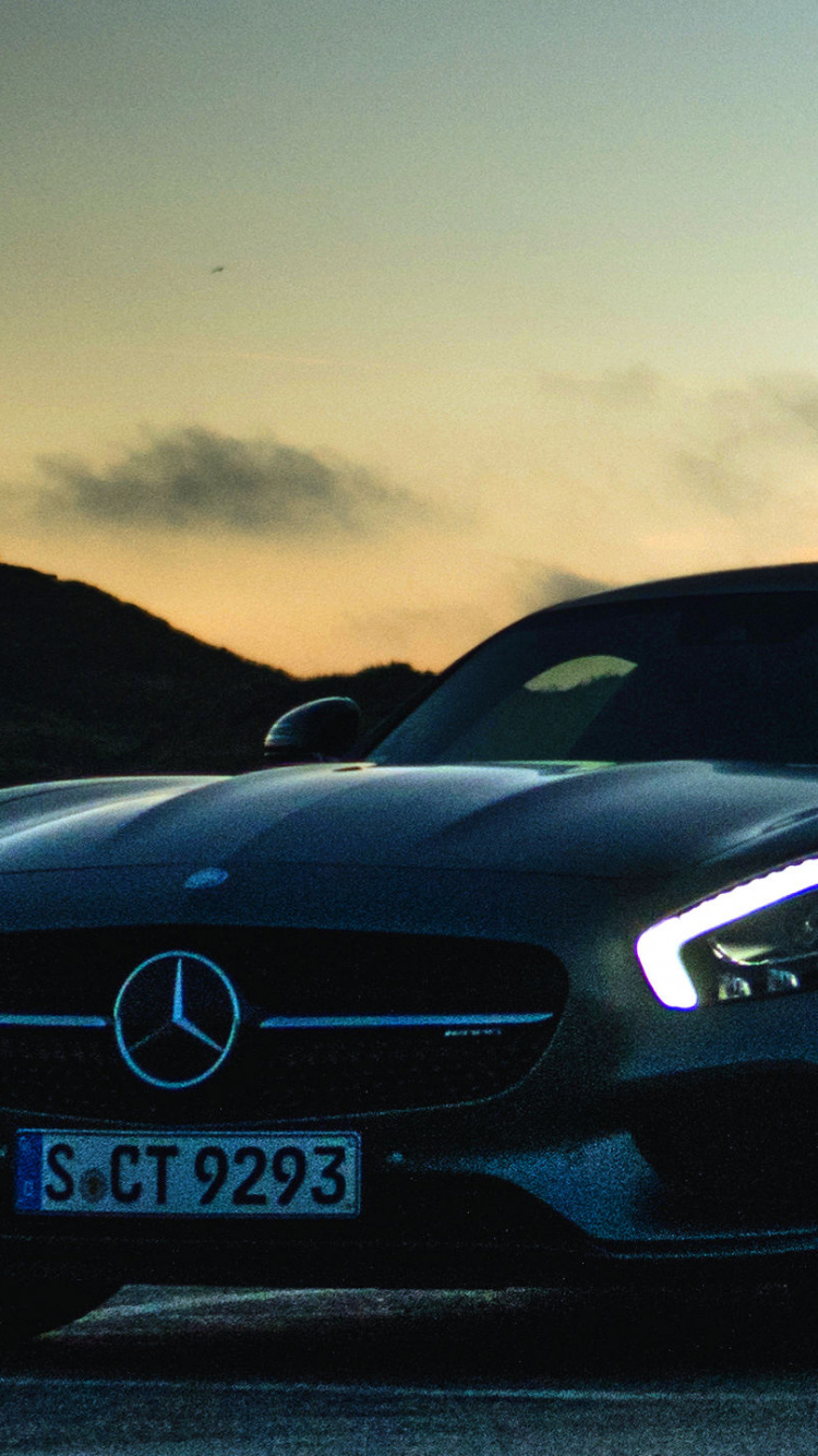 Black Bmw Coupe on Road During Sunset. Wallpaper in 750x1334 Resolution