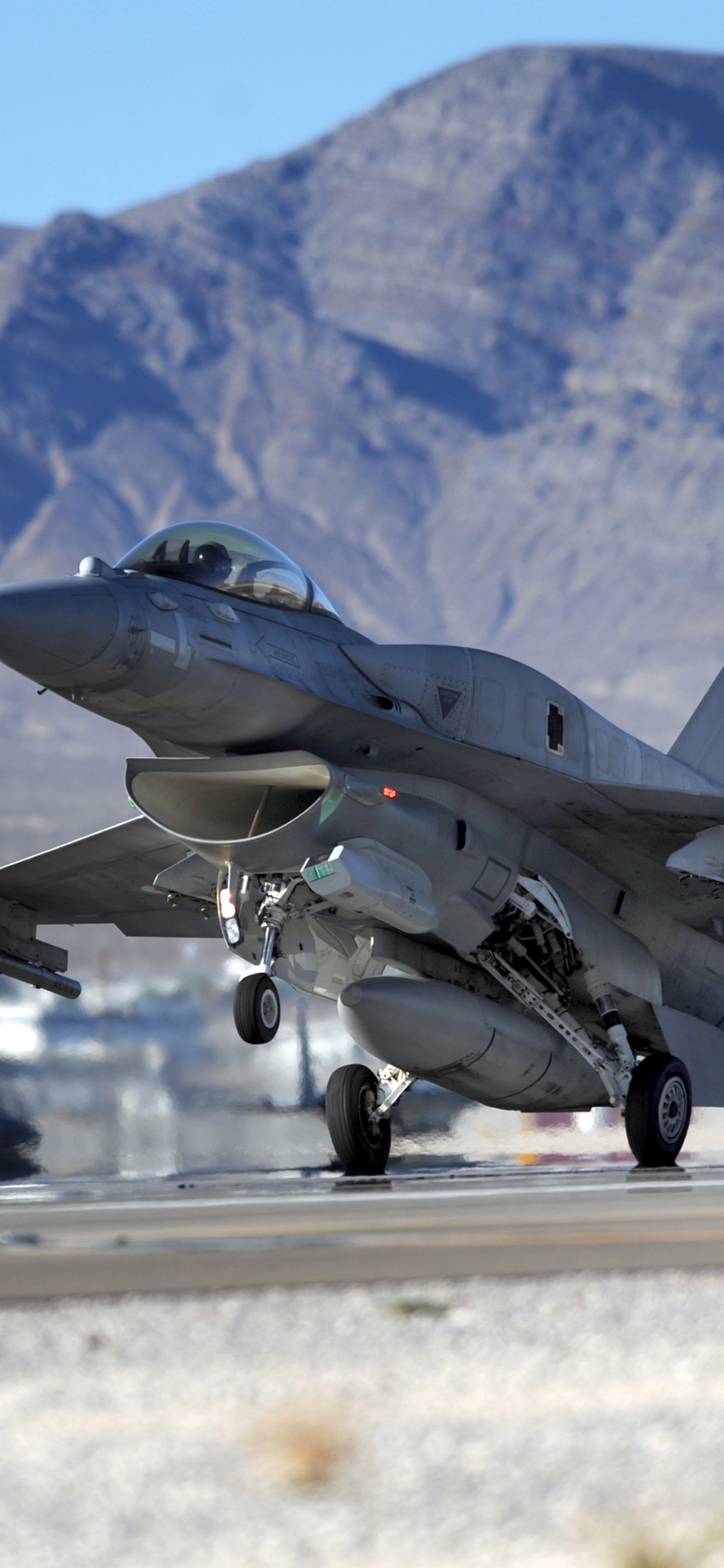 Gray Fighter Jet on Gray Concrete Road During Daytime. Wallpaper in 1242x2688 Resolution