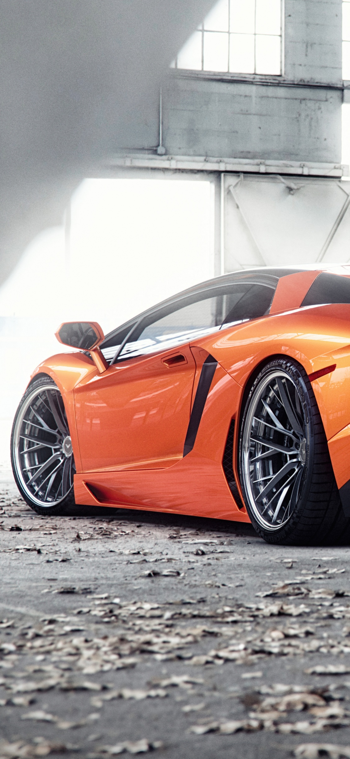 Orange Lamborghini Aventador in a Parking Lot. Wallpaper in 1125x2436 Resolution