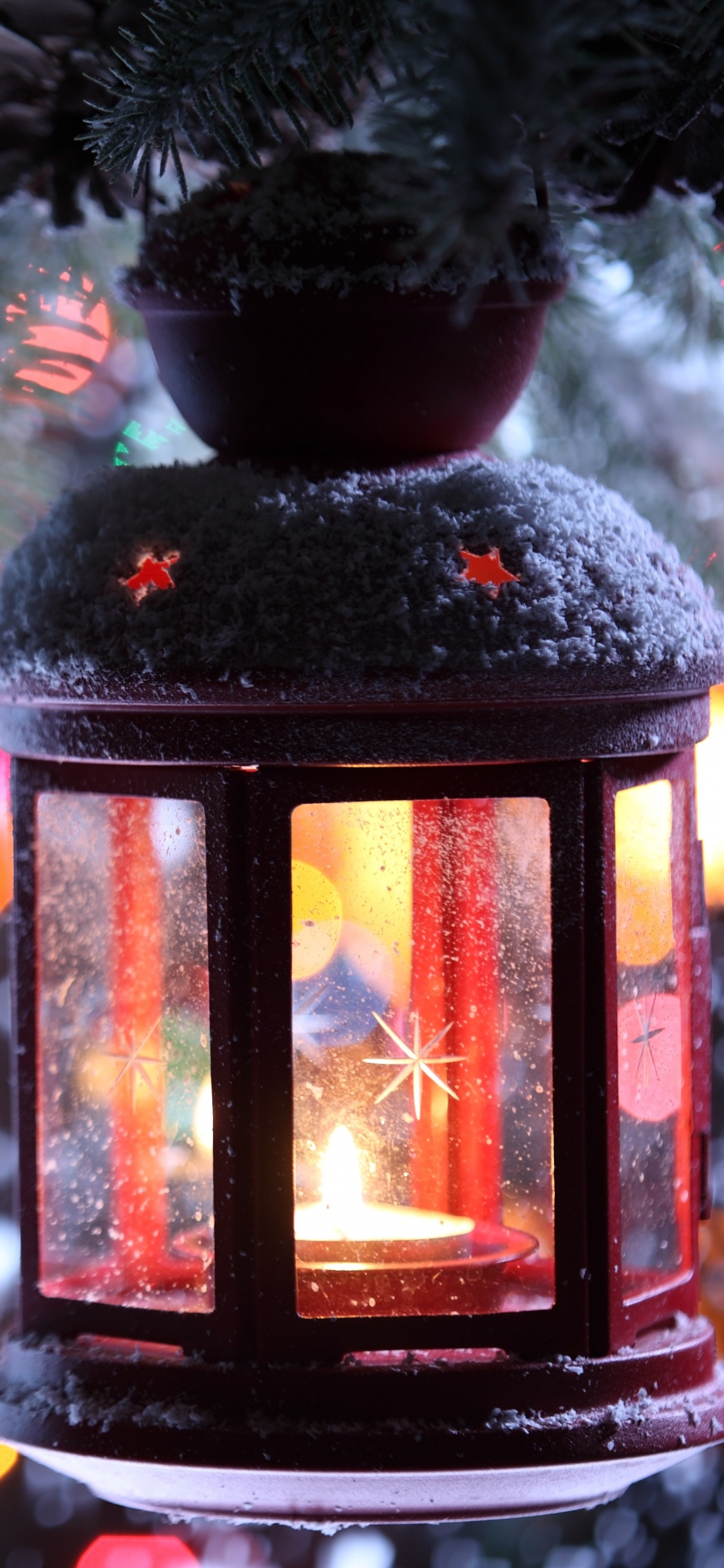 Linterna Negra Con Luces Bokeh. Wallpaper in 1125x2436 Resolution