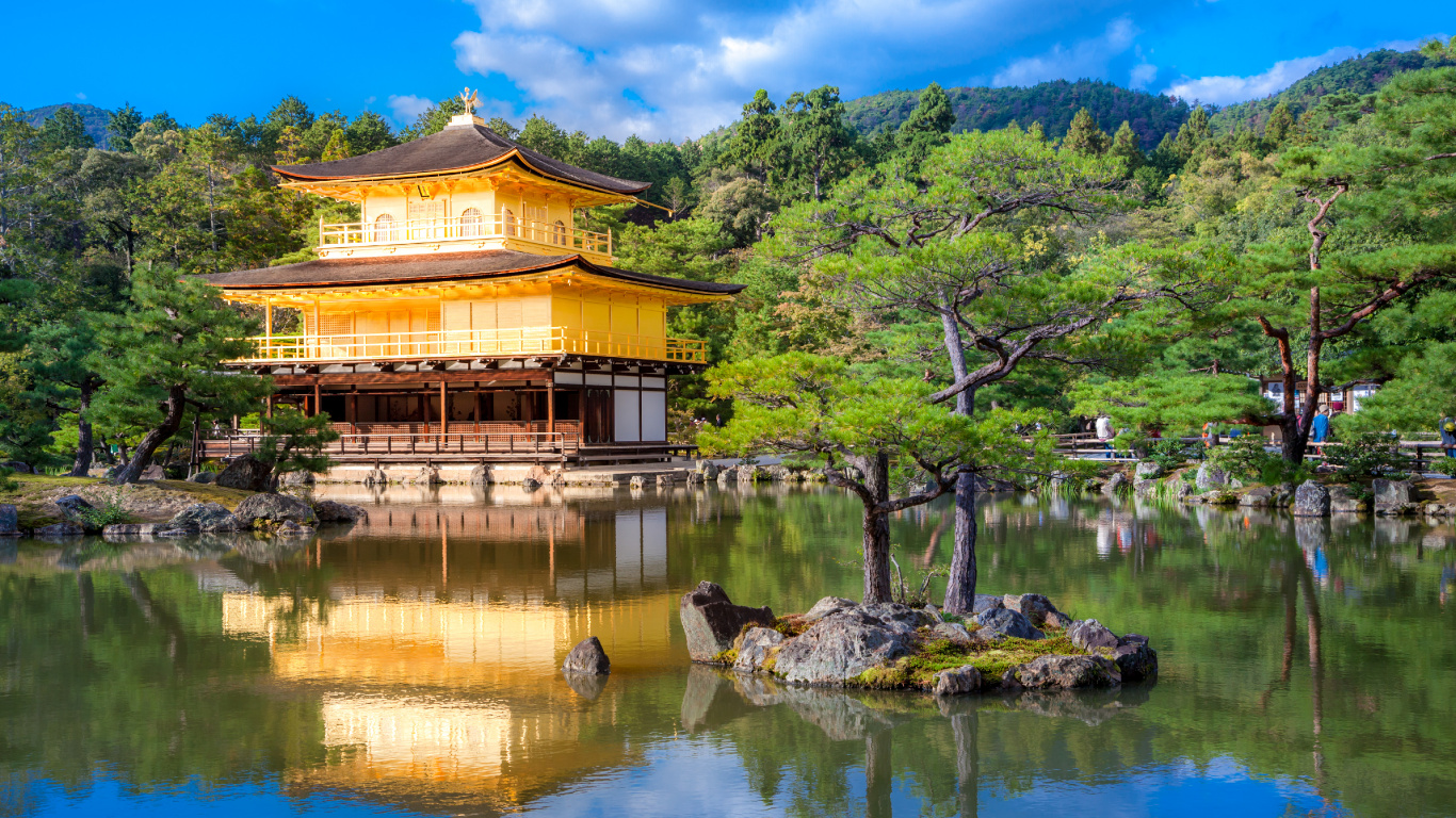 Brown Wooden House Near Green Trees and River During Daytime. Wallpaper in 1366x768 Resolution