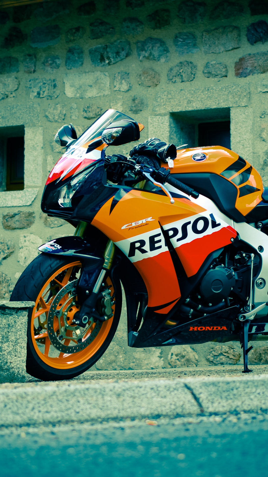Orange and Black Sports Bike Parked Beside Gray Concrete Wall During Daytime. Wallpaper in 1080x1920 Resolution