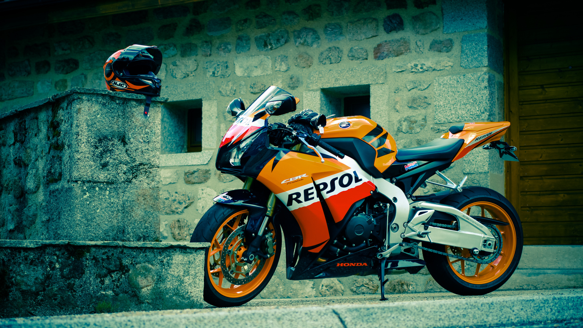 Orange and Black Sports Bike Parked Beside Gray Concrete Wall During Daytime. Wallpaper in 1920x1080 Resolution