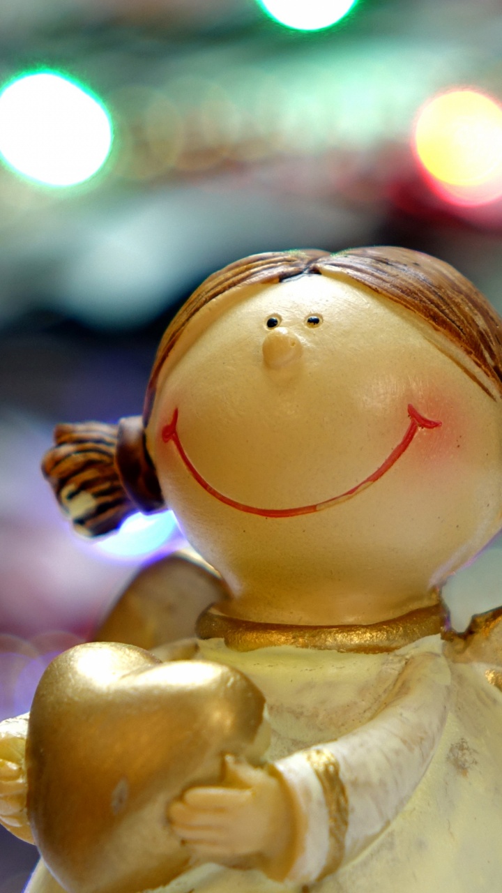 White Angel Ceramic Figurine in Bokeh Photography. Wallpaper in 720x1280 Resolution