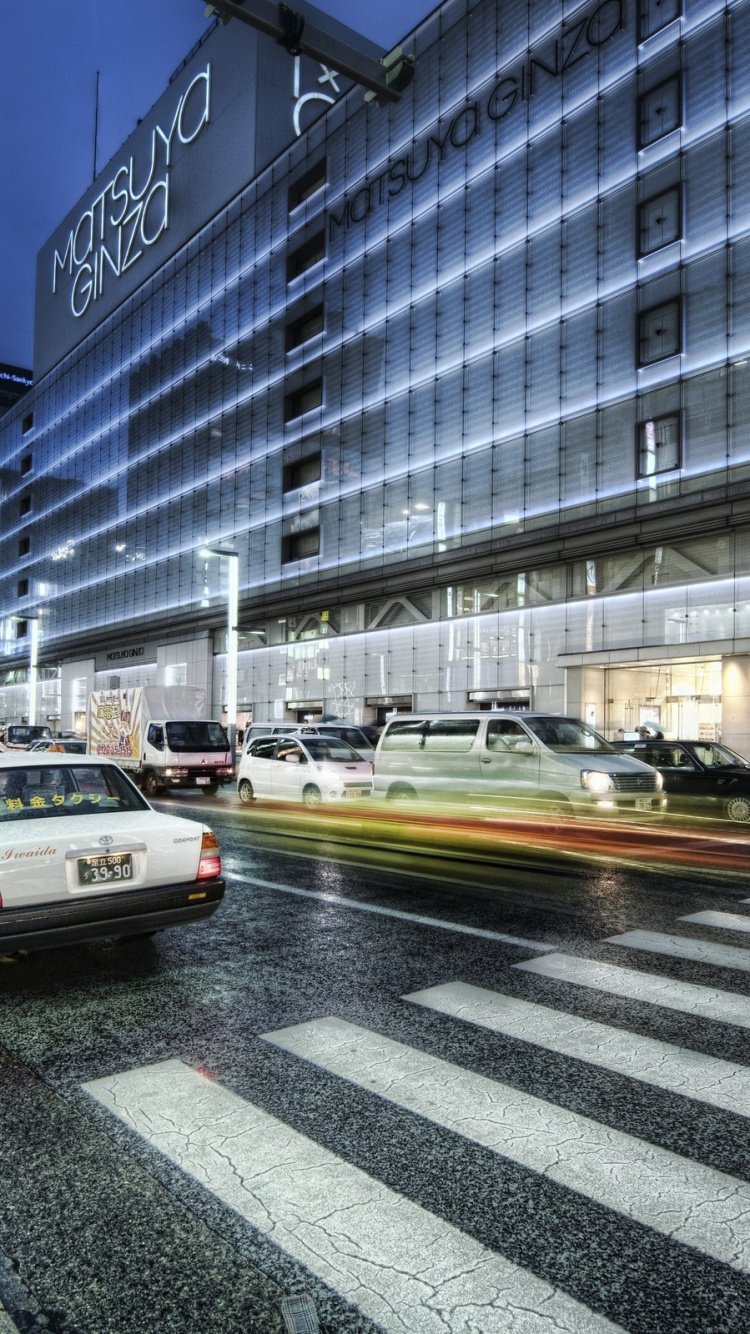 White Sedan on Road Near Building During Daytime. Wallpaper in 750x1334 Resolution
