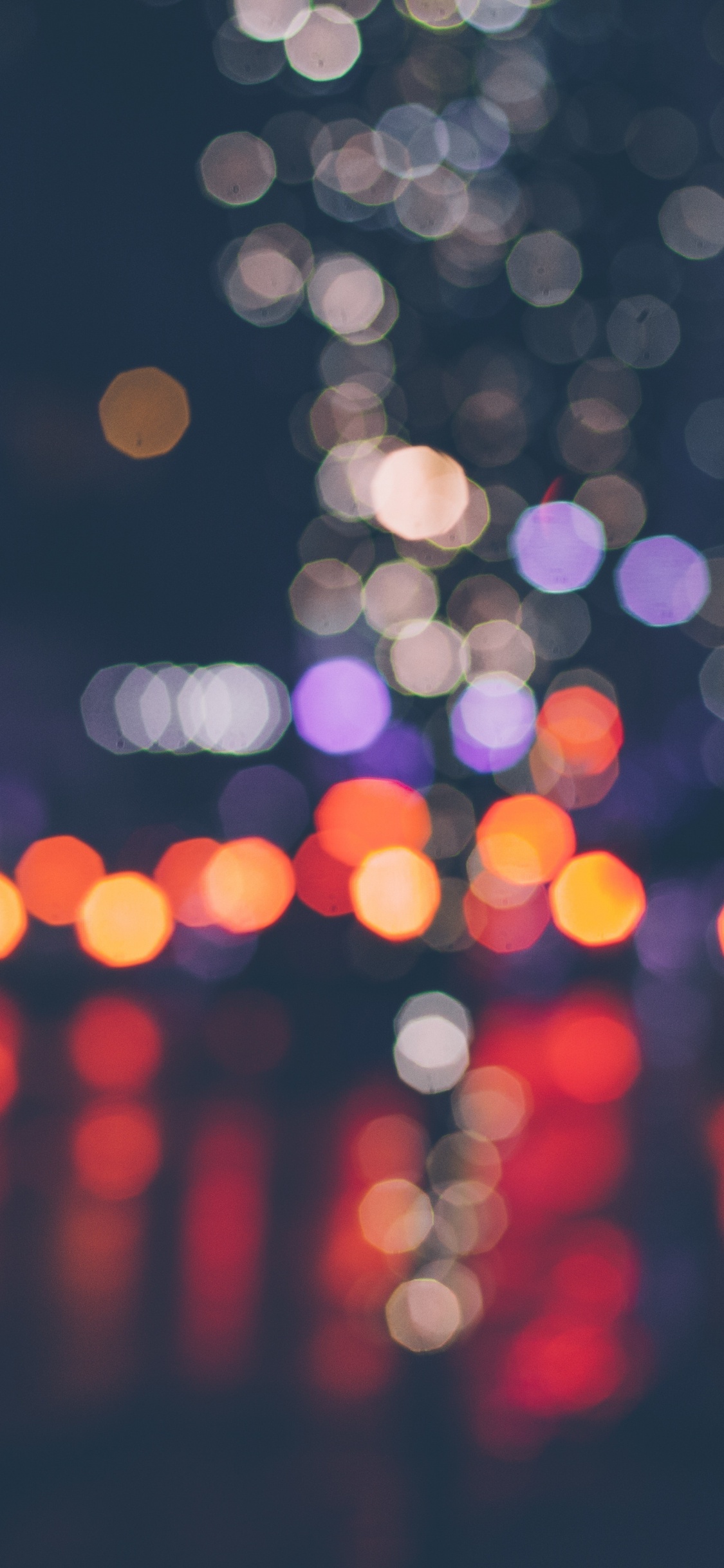 Bokeh Photography of Lights During Night Time. Wallpaper in 1125x2436 Resolution