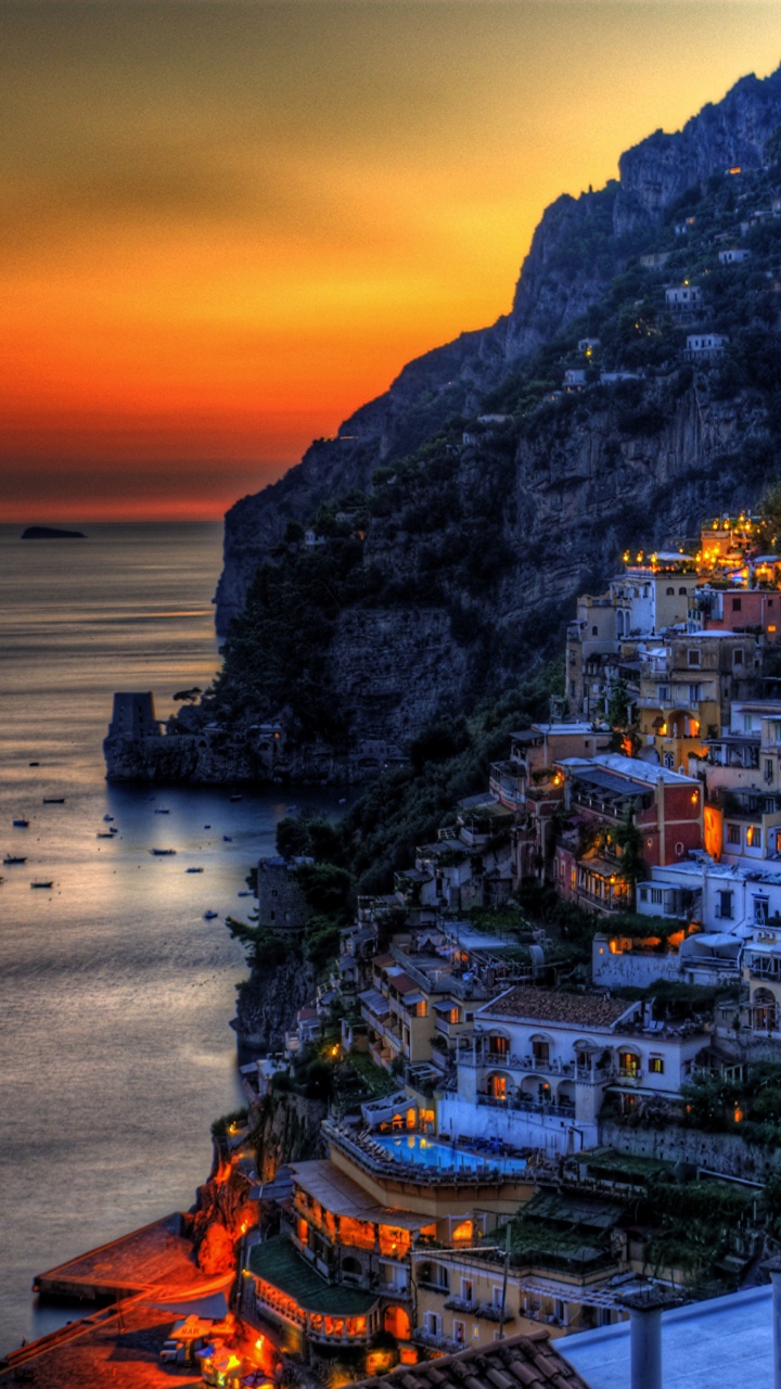 City Near Body of Water During Sunset. Wallpaper in 720x1280 Resolution