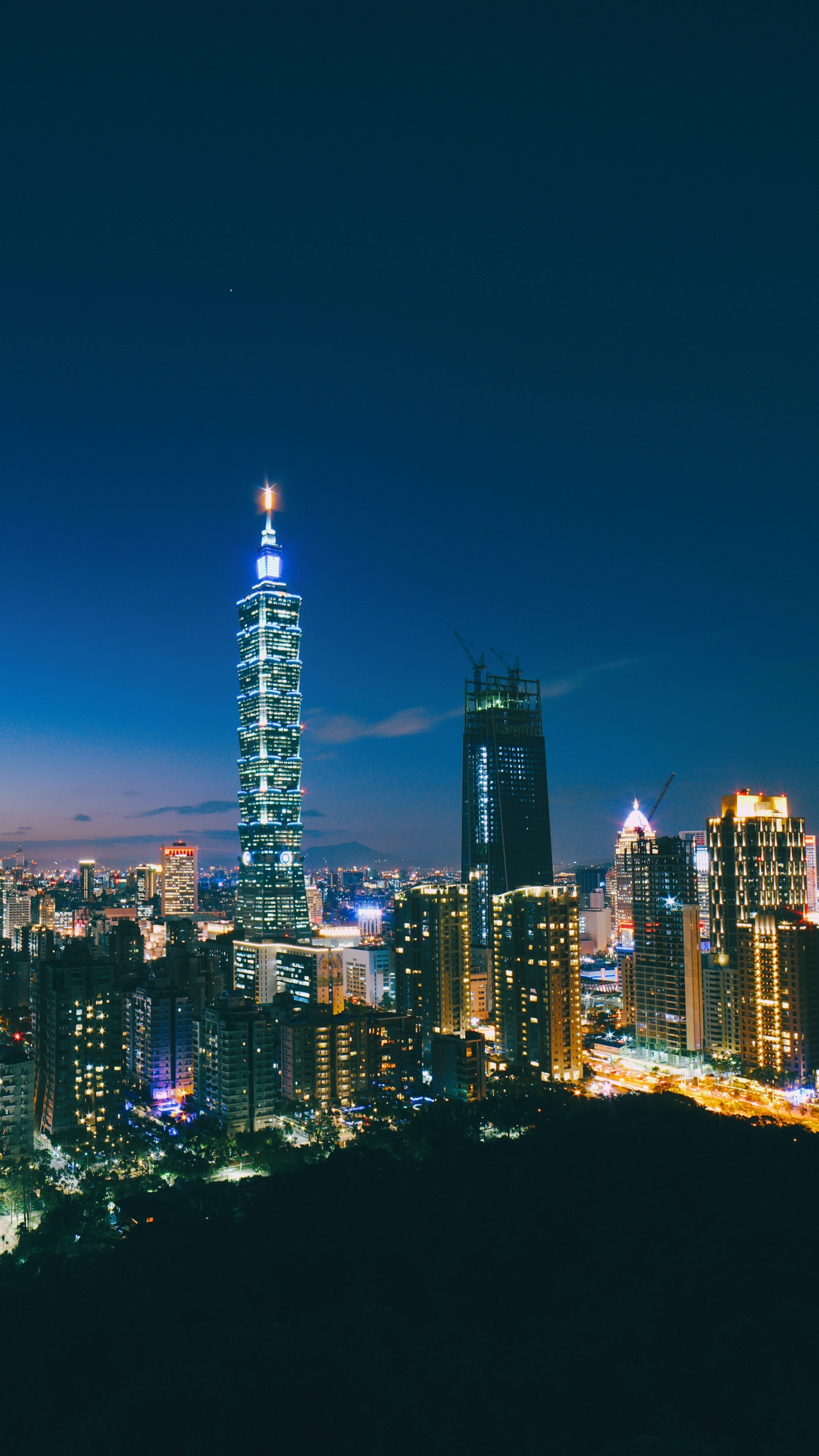 City Skyline During Night Time. Wallpaper in 1440x2560 Resolution