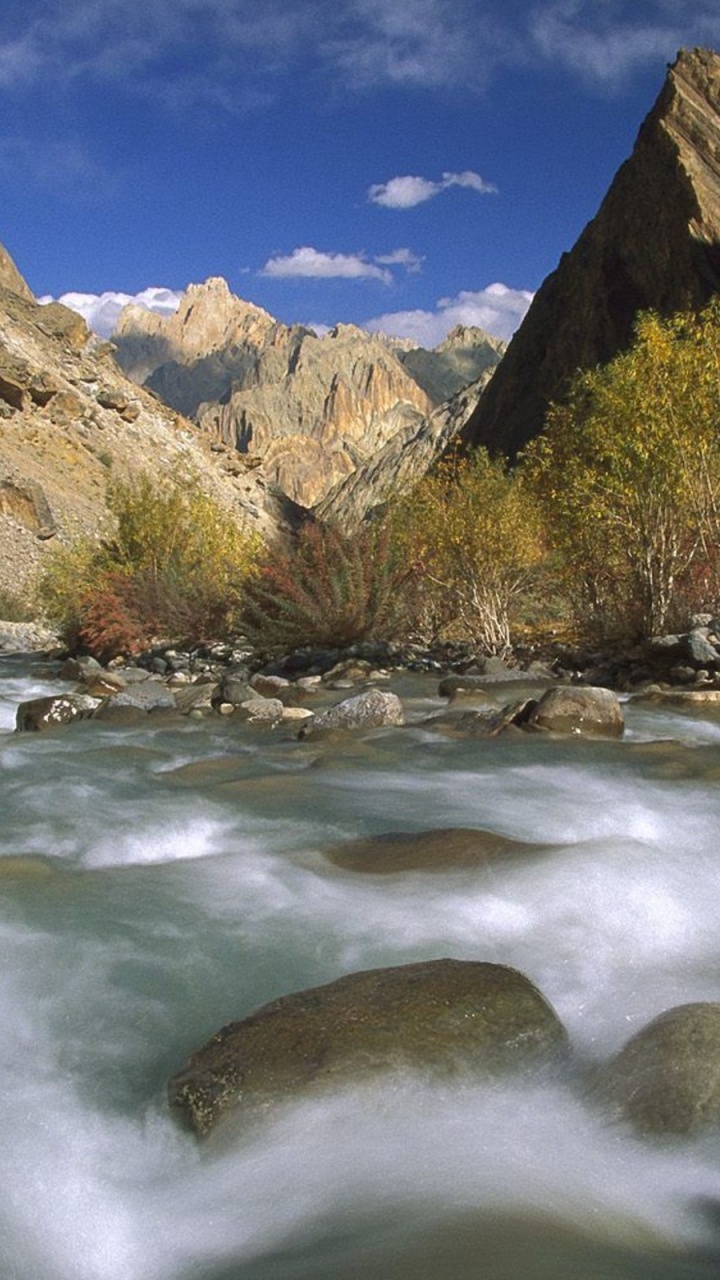 River in Between Trees and Mountains During Daytime. Wallpaper in 720x1280 Resolution