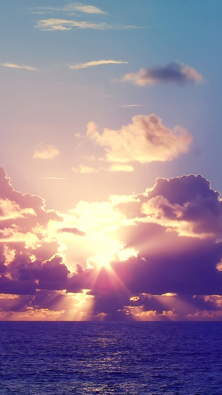 Body of Water Under Blue Sky During Sunset. Wallpaper in 750x1334 Resolution