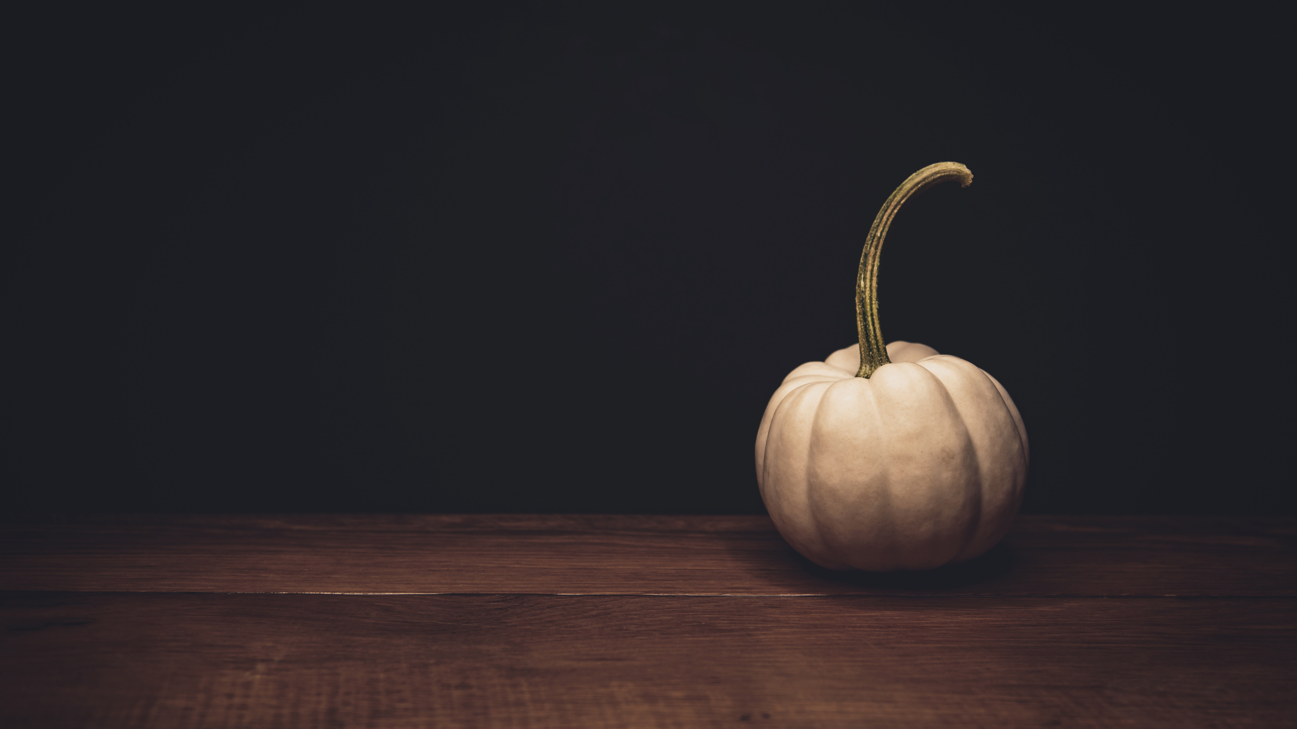 Pumpkin on Brown Wooden Table. Wallpaper in 2560x1440 Resolution