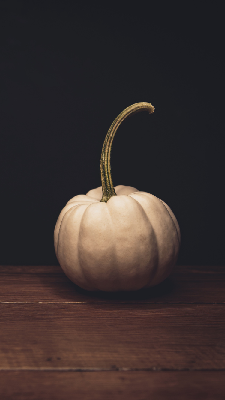 Pumpkin on Brown Wooden Table. Wallpaper in 750x1334 Resolution