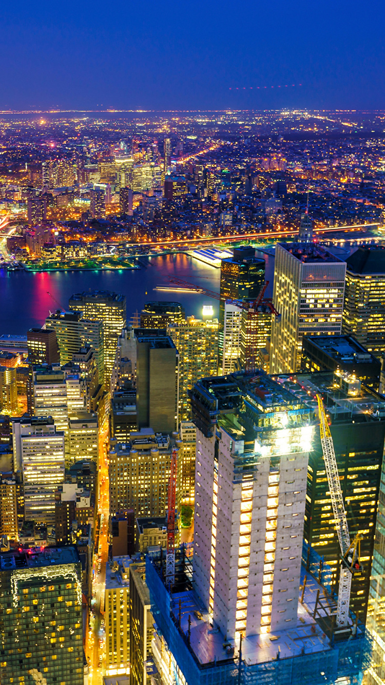Aerial View of City Buildings During Night Time. Wallpaper in 750x1334 Resolution