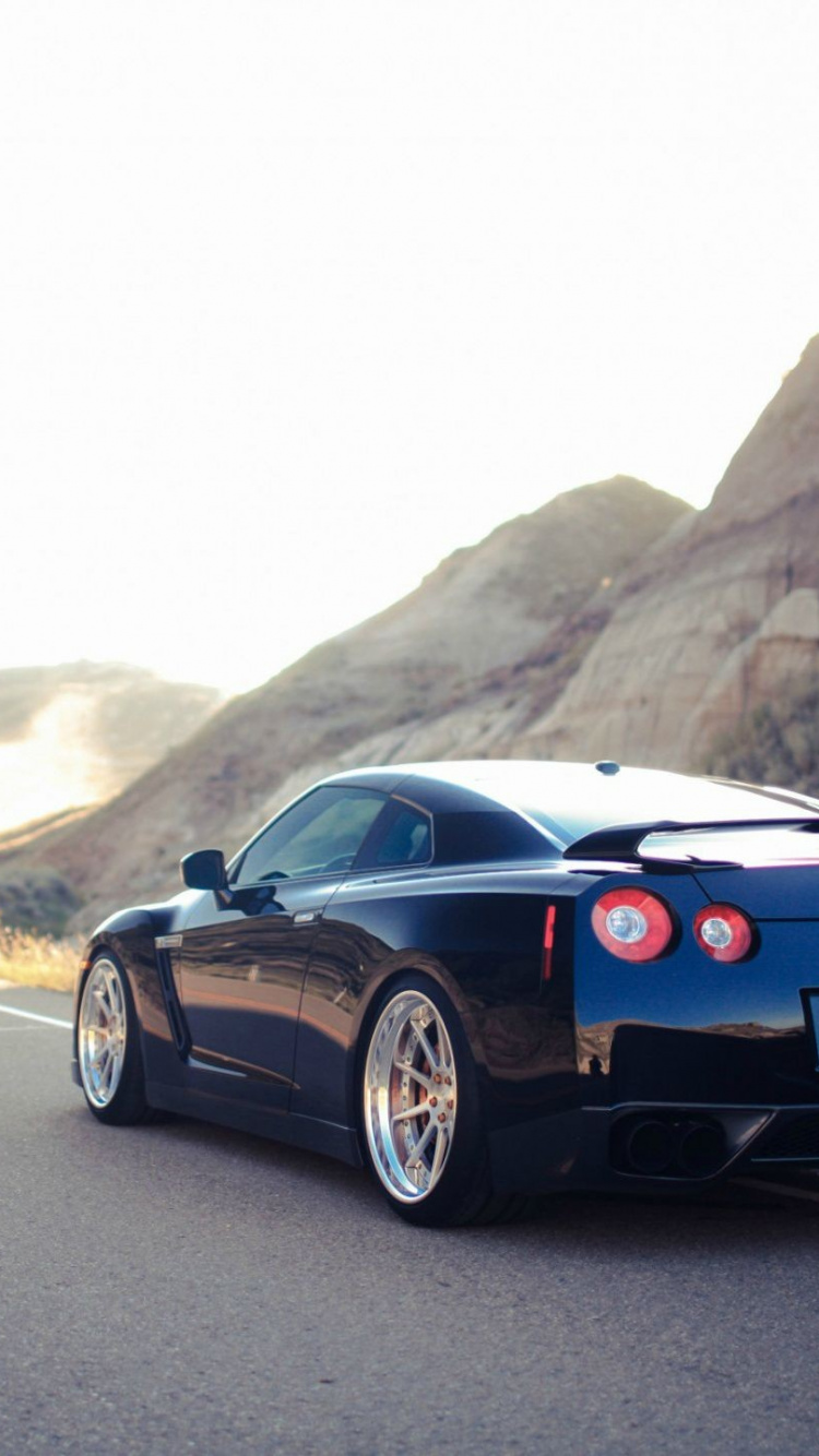 Black Porsche 911 on Road During Daytime. Wallpaper in 750x1334 Resolution