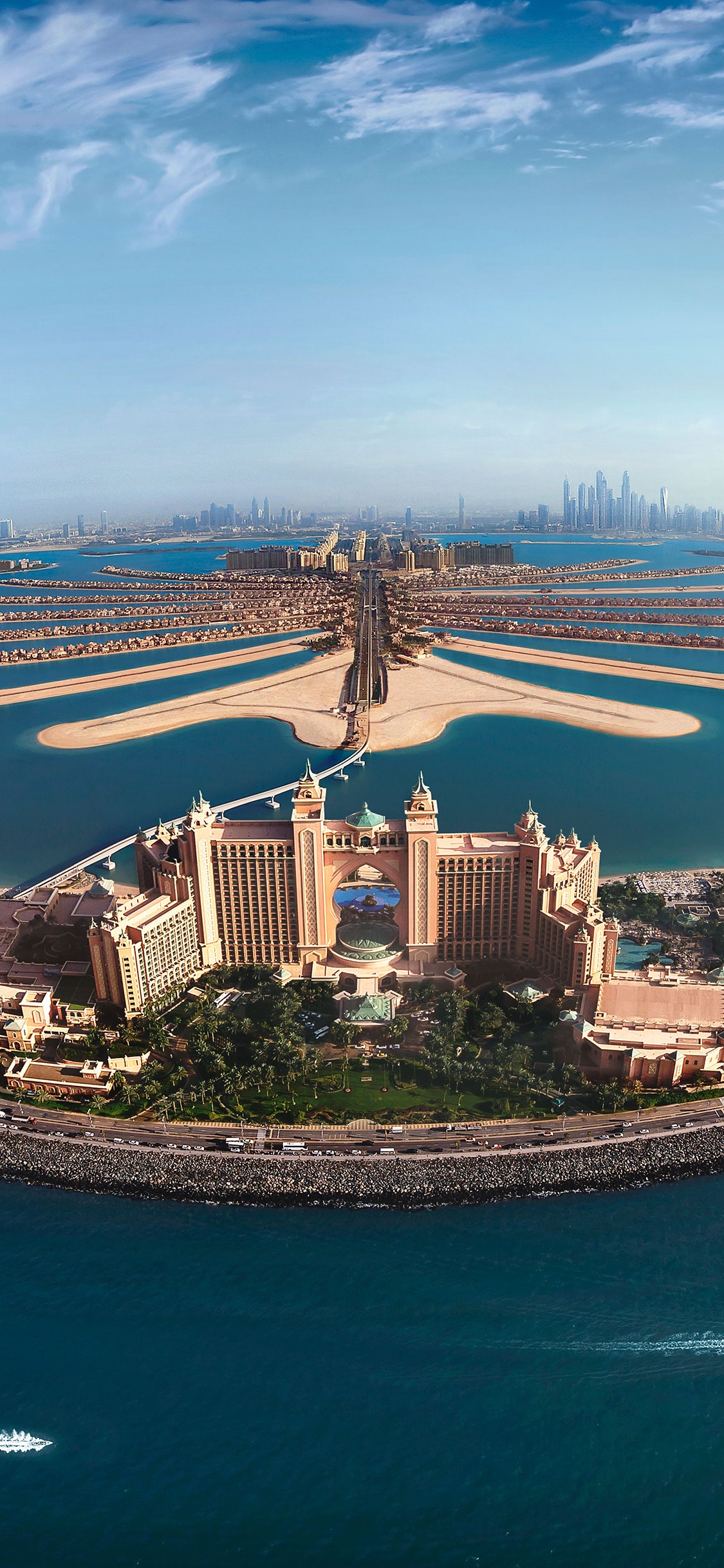 Vue Aérienne Des Bâtiments de la Ville Près du Plan D'eau Pendant la Journée. Wallpaper in 1125x2436 Resolution