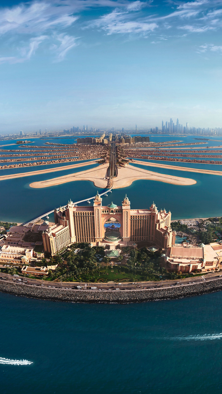 Aerial View of City Buildings Near Body of Water During Daytime. Wallpaper in 750x1334 Resolution