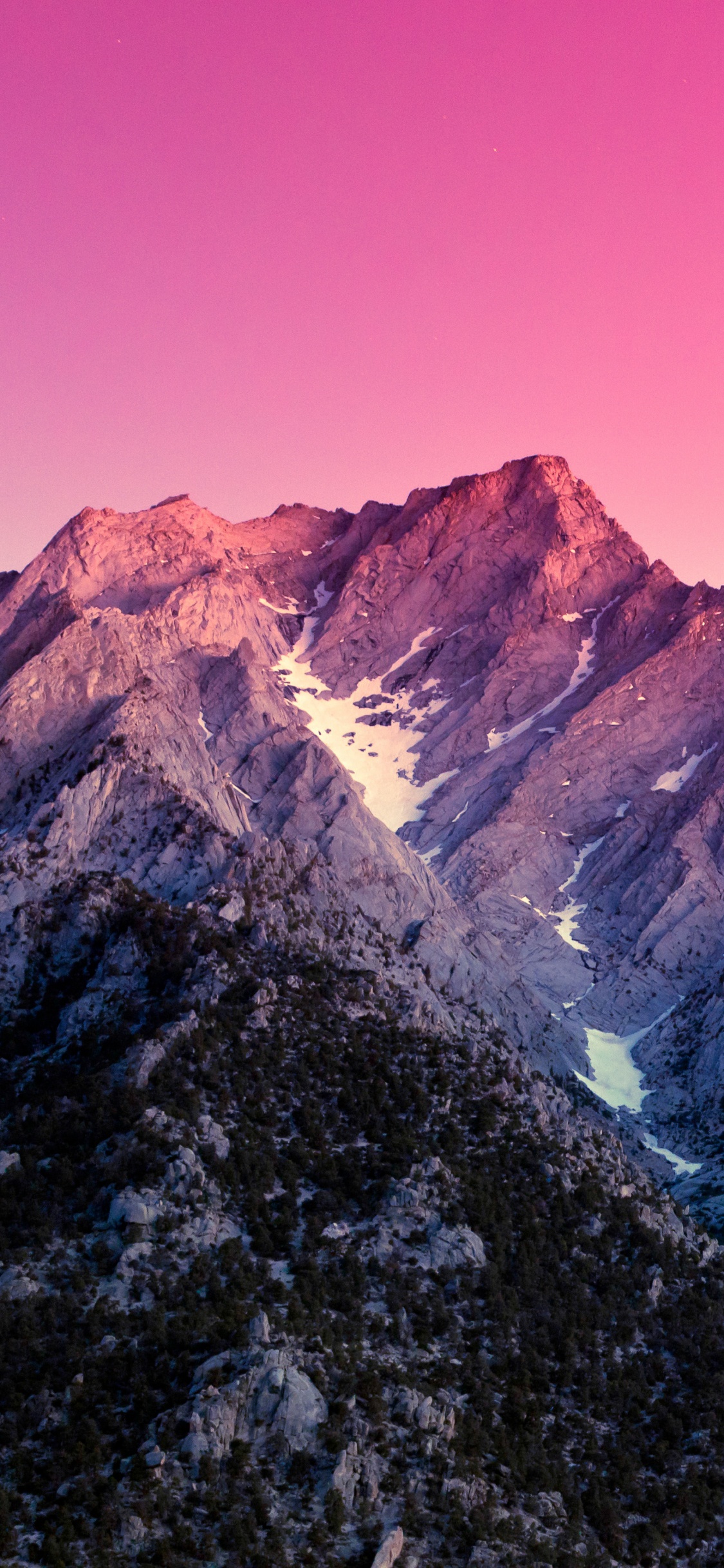 Montaña Rocosa Marrón y Gris Bajo un Cielo Azul Durante el Día. Wallpaper in 1125x2436 Resolution
