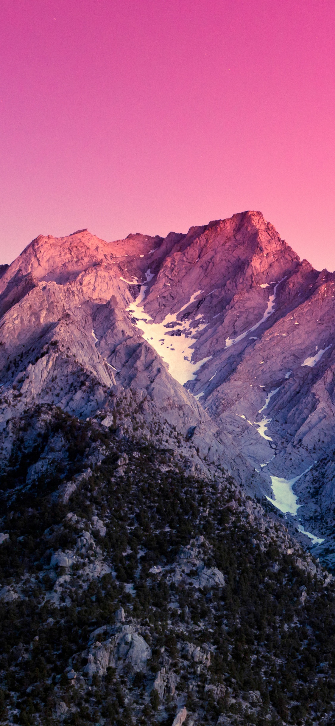 Brown and Gray Rocky Mountain Under Blue Sky During Daytime. Wallpaper in 1125x2436 Resolution