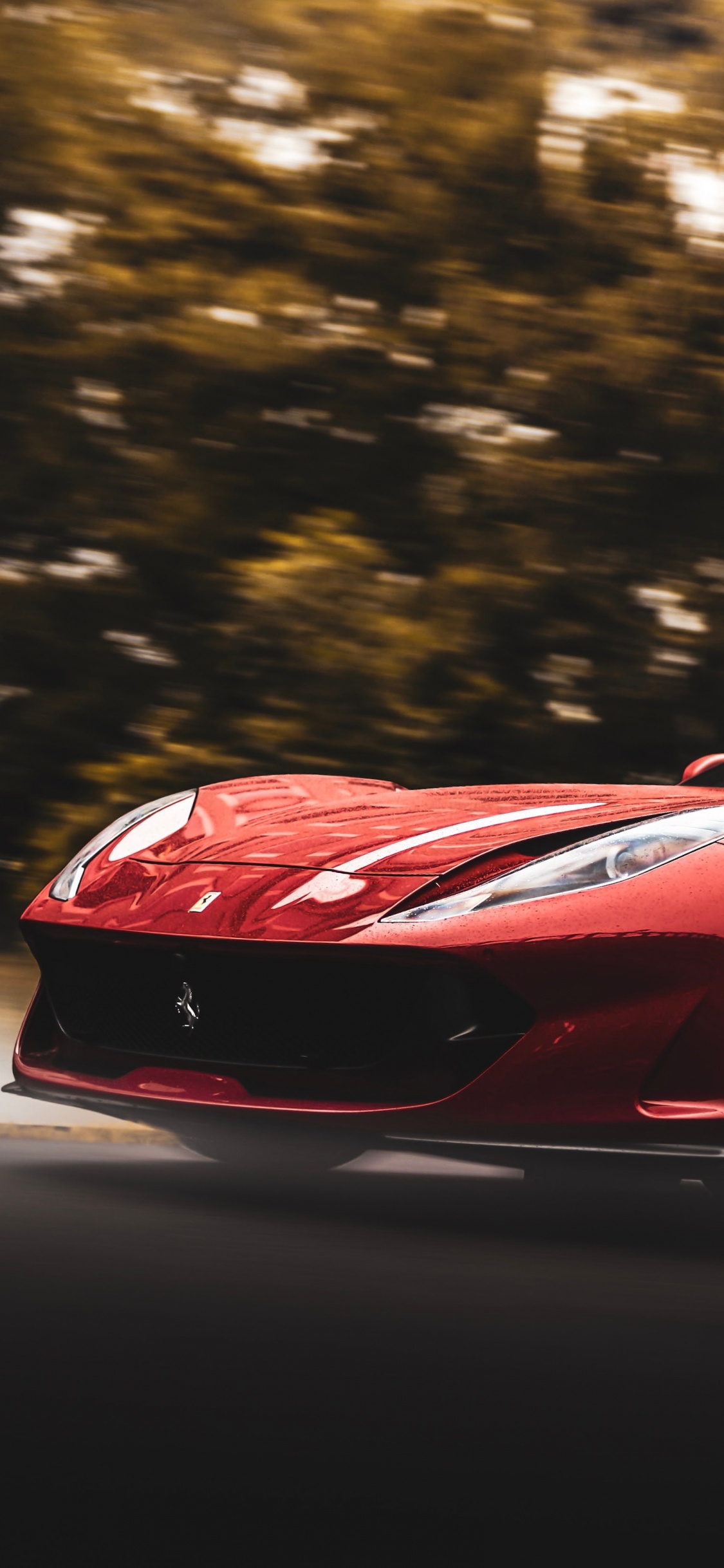 Roter Ferrari 458 Italia Tagsüber Unterwegs. Wallpaper in 1125x2436 Resolution