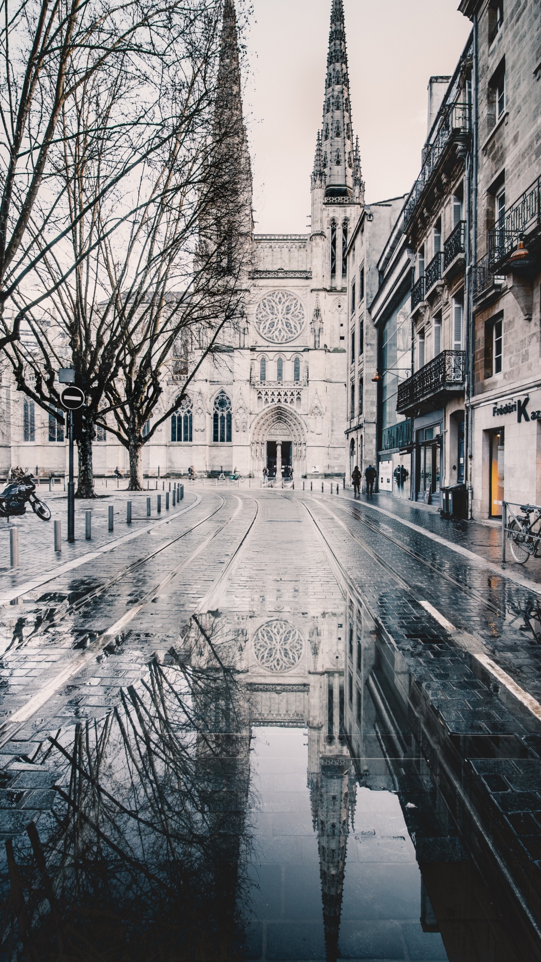 People Walking on Sidewalk Near Brown Concrete Building During Daytime. Wallpaper in 1080x1920 Resolution