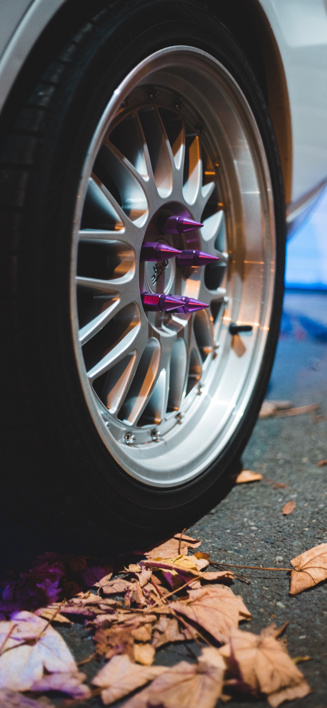 Silver Multi Spoke Wheel With Tire. Wallpaper in 1125x2436 Resolution