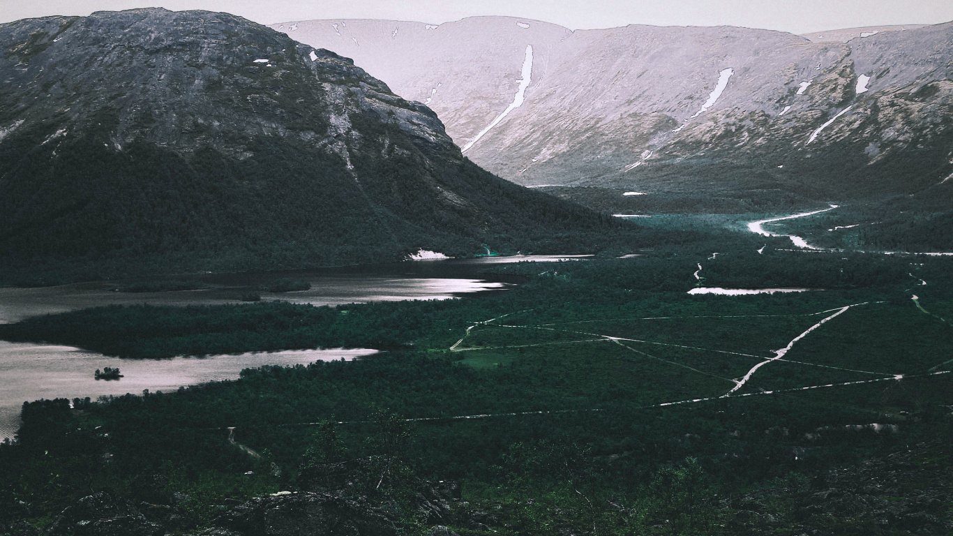 Green Grass Field Near Lake and Mountains During Daytime. Wallpaper in 1366x768 Resolution