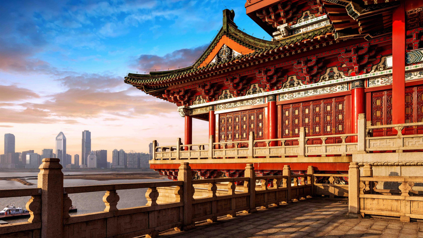 Red and Brown Temple Near Body of Water During Daytime. Wallpaper in 1366x768 Resolution