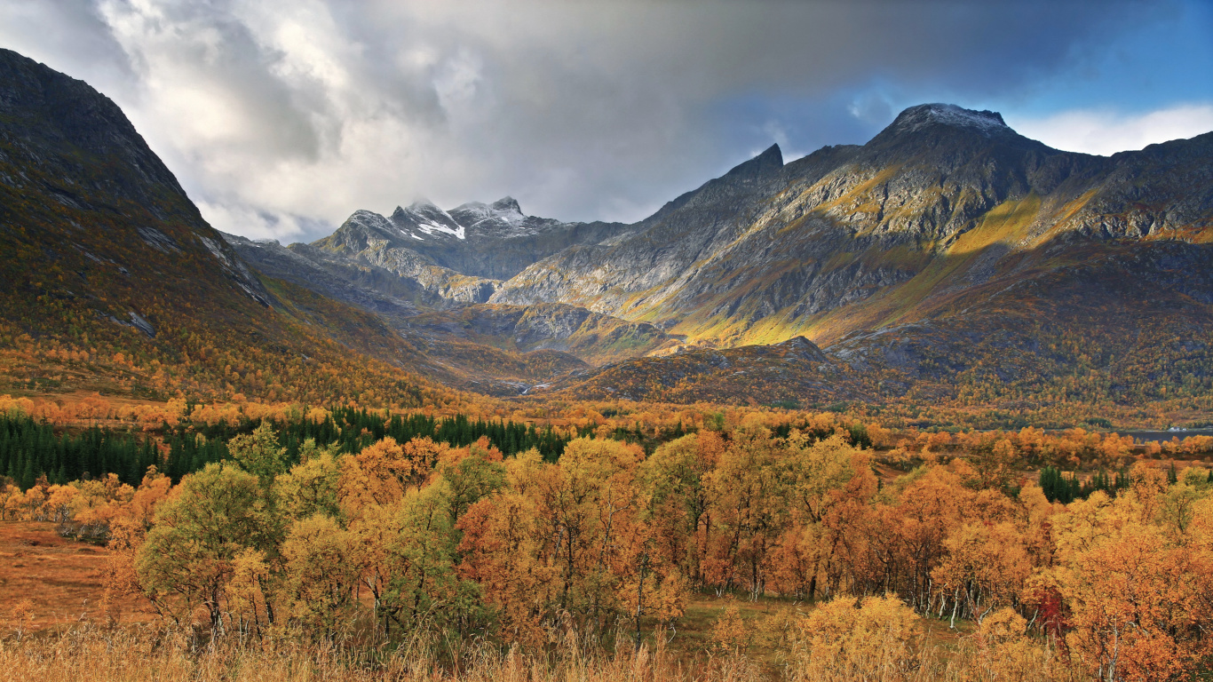 Brown and Green Mountains Under White Clouds During Daytime. Wallpaper in 1366x768 Resolution