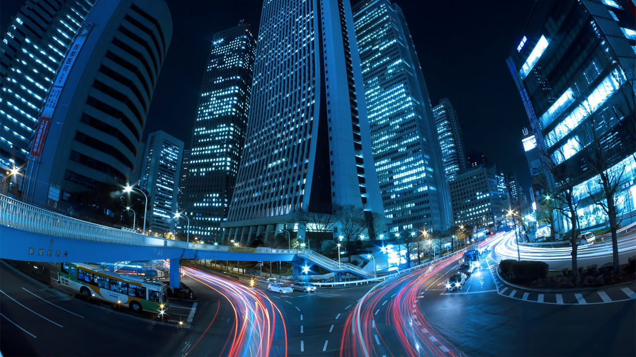 Cars on Road Near High Rise Buildings During Night Time. Wallpaper in 1280x720 Resolution