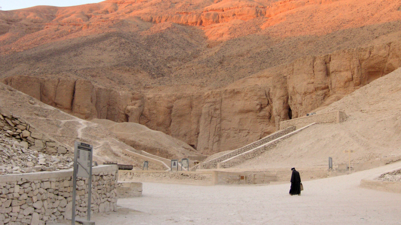 Person in Black Jacket Walking on Snow Covered Ground During Daytime. Wallpaper in 1280x720 Resolution