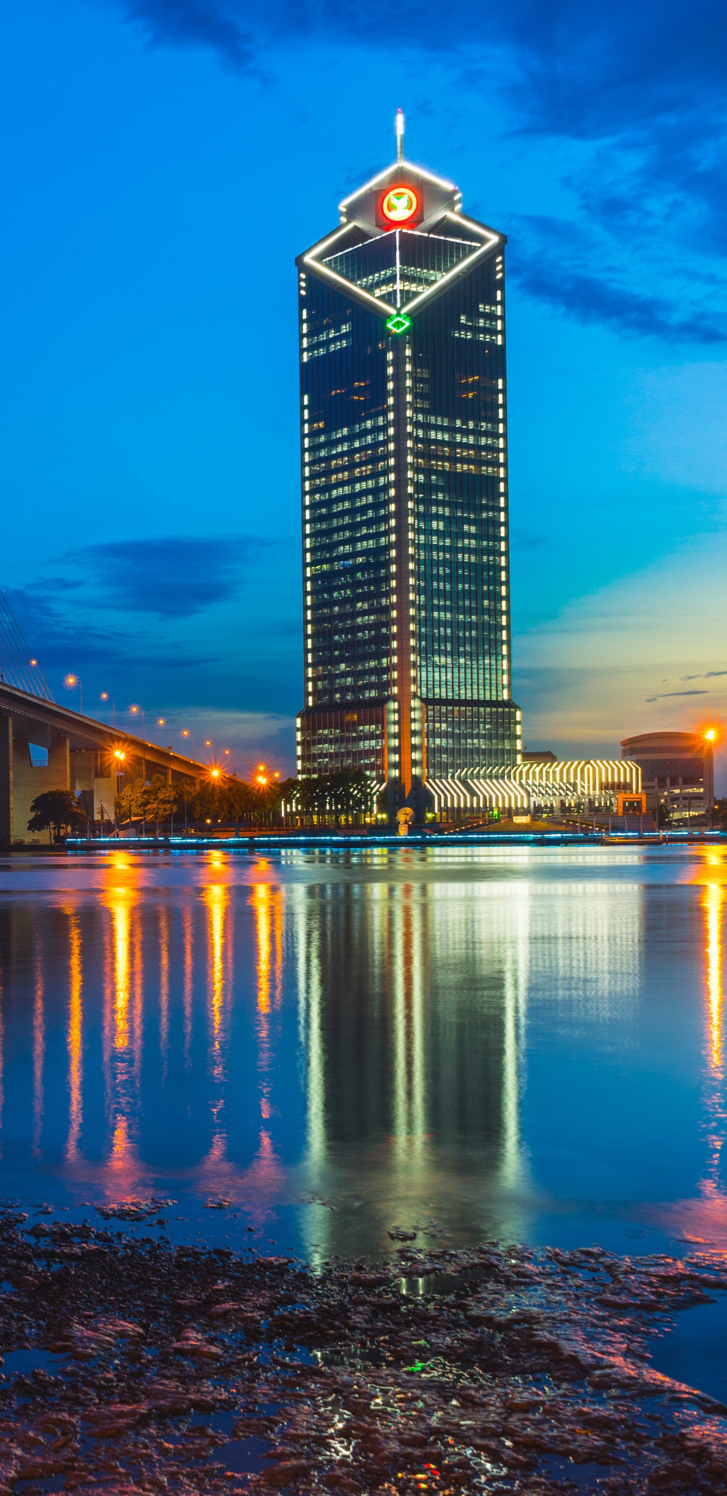 Lighted Bridge Over Water During Night Time. Wallpaper in 1440x2960 Resolution