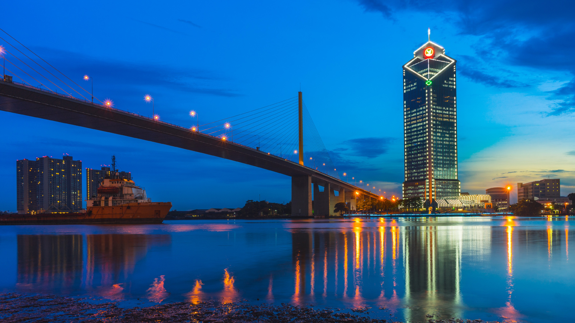Lighted Bridge Over Water During Night Time. Wallpaper in 1920x1080 Resolution