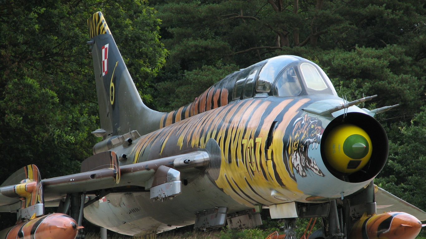 People Walking Near Green and Yellow Fighter Plane During Daytime. Wallpaper in 1366x768 Resolution