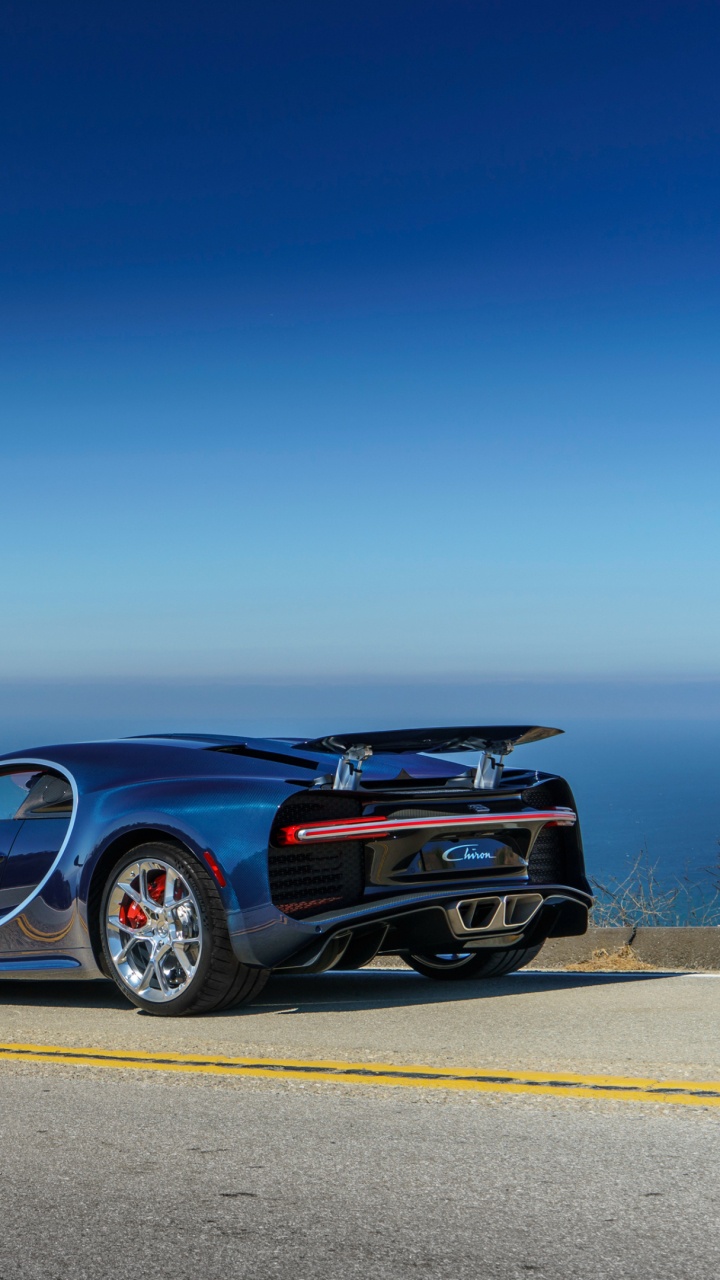 Black Coupe on Gray Asphalt Road During Daytime. Wallpaper in 720x1280 Resolution