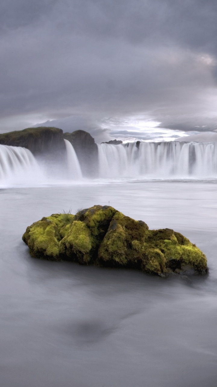 Water Falls Under Cloudy Sky. Wallpaper in 720x1280 Resolution