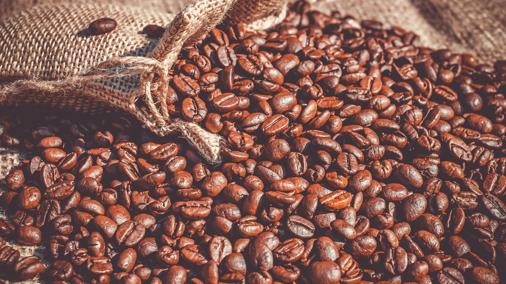 Brown Coffee Beans on Brown Sand. Wallpaper in 1920x1080 Resolution