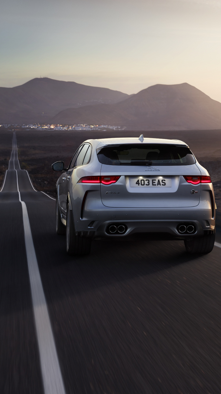 White Suv on Road During Daytime. Wallpaper in 750x1334 Resolution