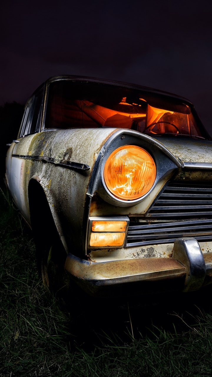 Black and Brown Car on Green Grass Field. Wallpaper in 720x1280 Resolution
