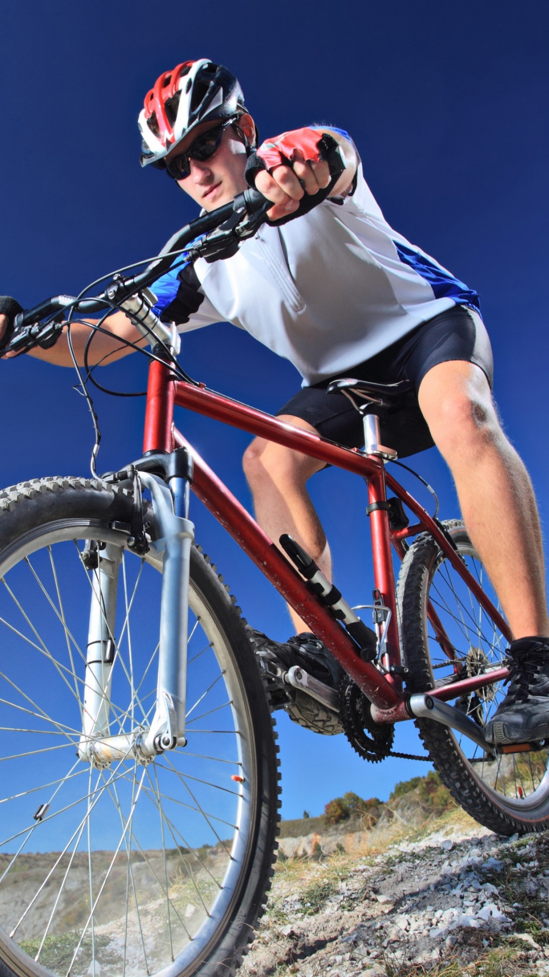 Man in White Shirt Riding on Red Mountain Bike During Daytime. Wallpaper in 1080x1920 Resolution