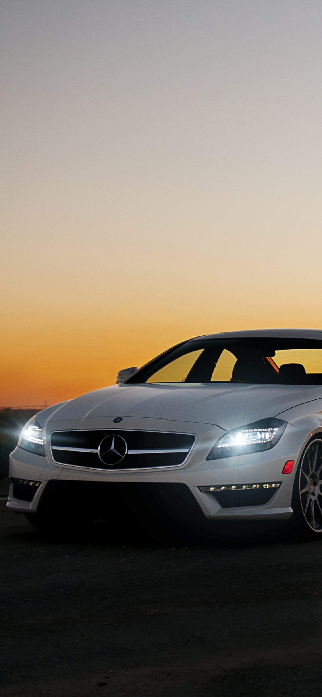 White Bmw m 3 Coupe on Road During Sunset. Wallpaper in 1125x2436 Resolution