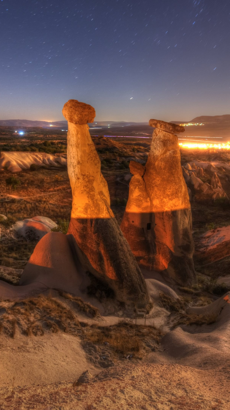 Brown Rock Formation During Night Time. Wallpaper in 750x1334 Resolution