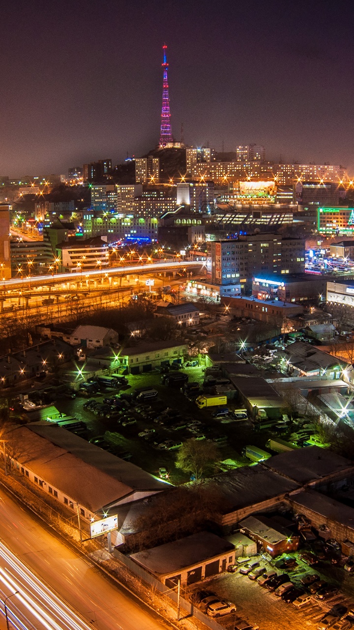 Edificios de la Ciudad Durante la Noche.. Wallpaper in 720x1280 Resolution
