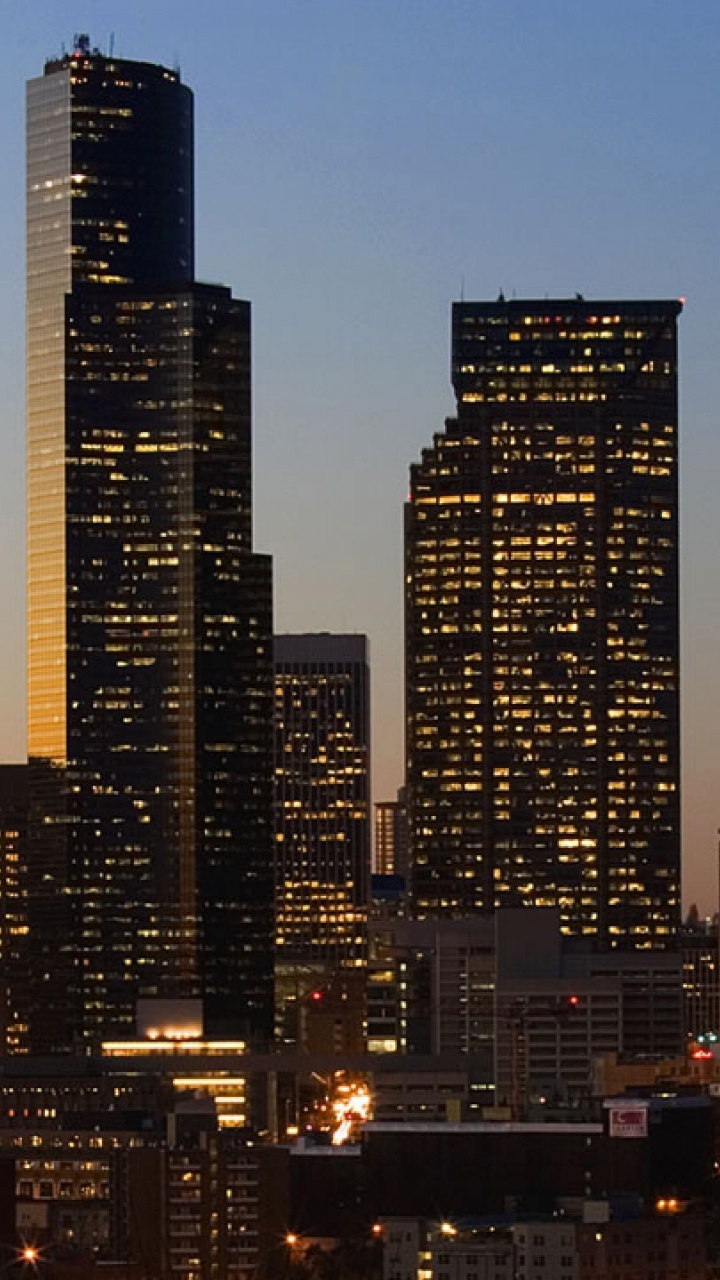 City Buildings During Night Time. Wallpaper in 720x1280 Resolution