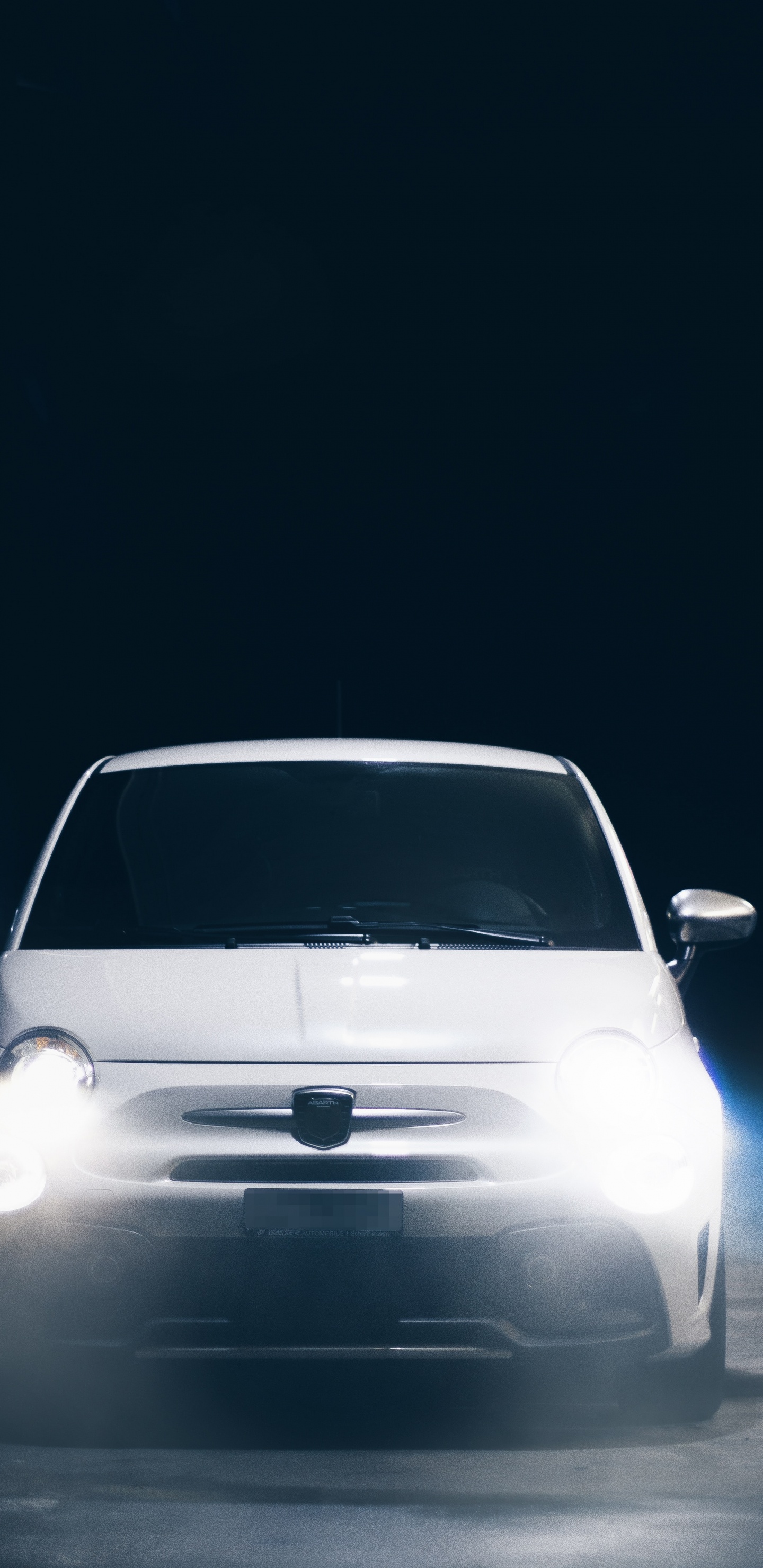 White Car in a Dark Room. Wallpaper in 1440x2960 Resolution