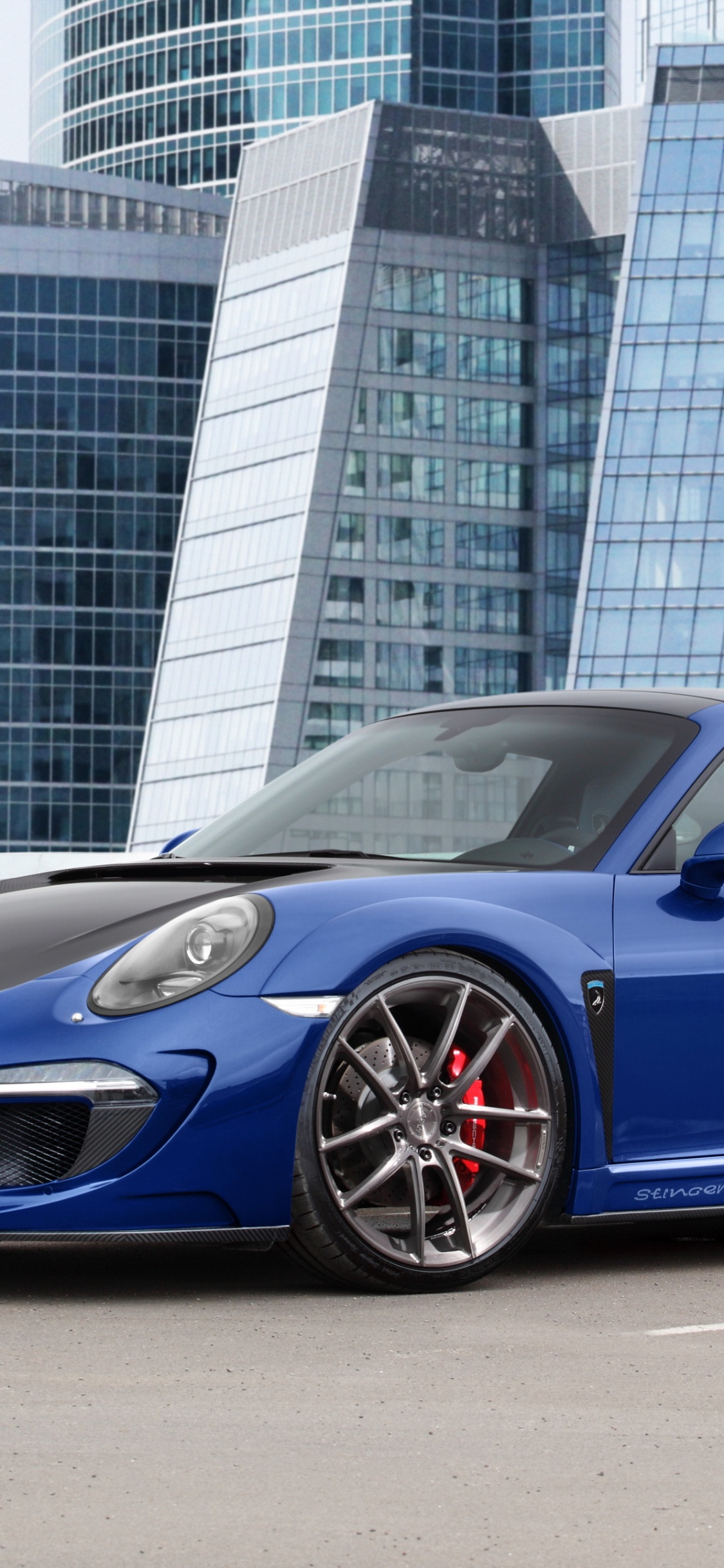 Blue Bmw m 3 Coupe Parked Near White Concrete Building During Daytime. Wallpaper in 1125x2436 Resolution