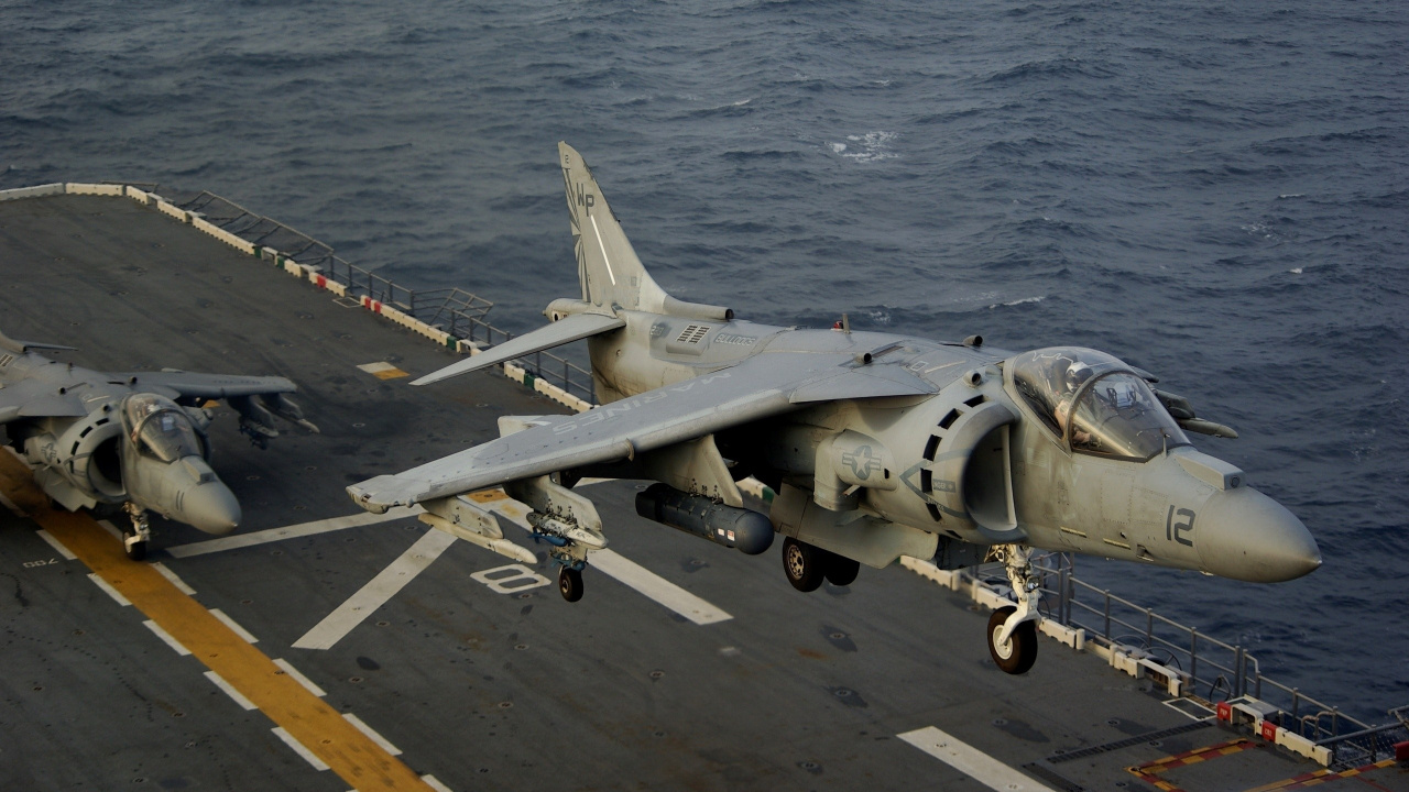 Gray Fighter Plane on Dock During Daytime. Wallpaper in 1280x720 Resolution