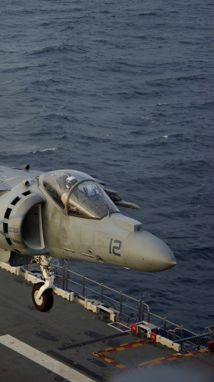Gray Fighter Plane on Dock During Daytime. Wallpaper in 720x1280 Resolution