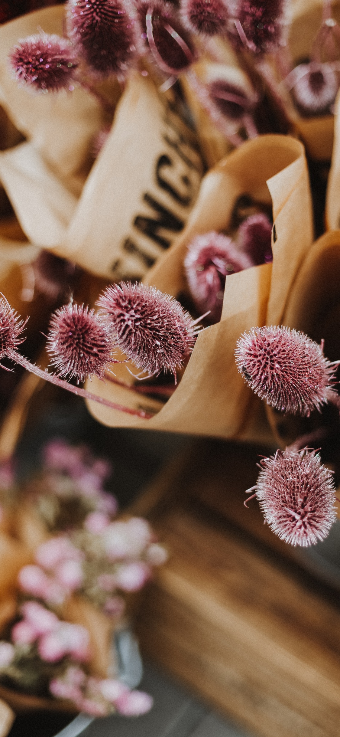 Pink and White Flowers on Brown Wooden Rack. Wallpaper in 1125x2436 Resolution